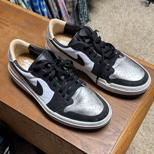 Nike Women's Black, White, and Silver Sneakers. Jordan’s